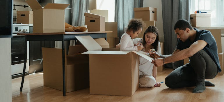 a family packing their items safely before the move